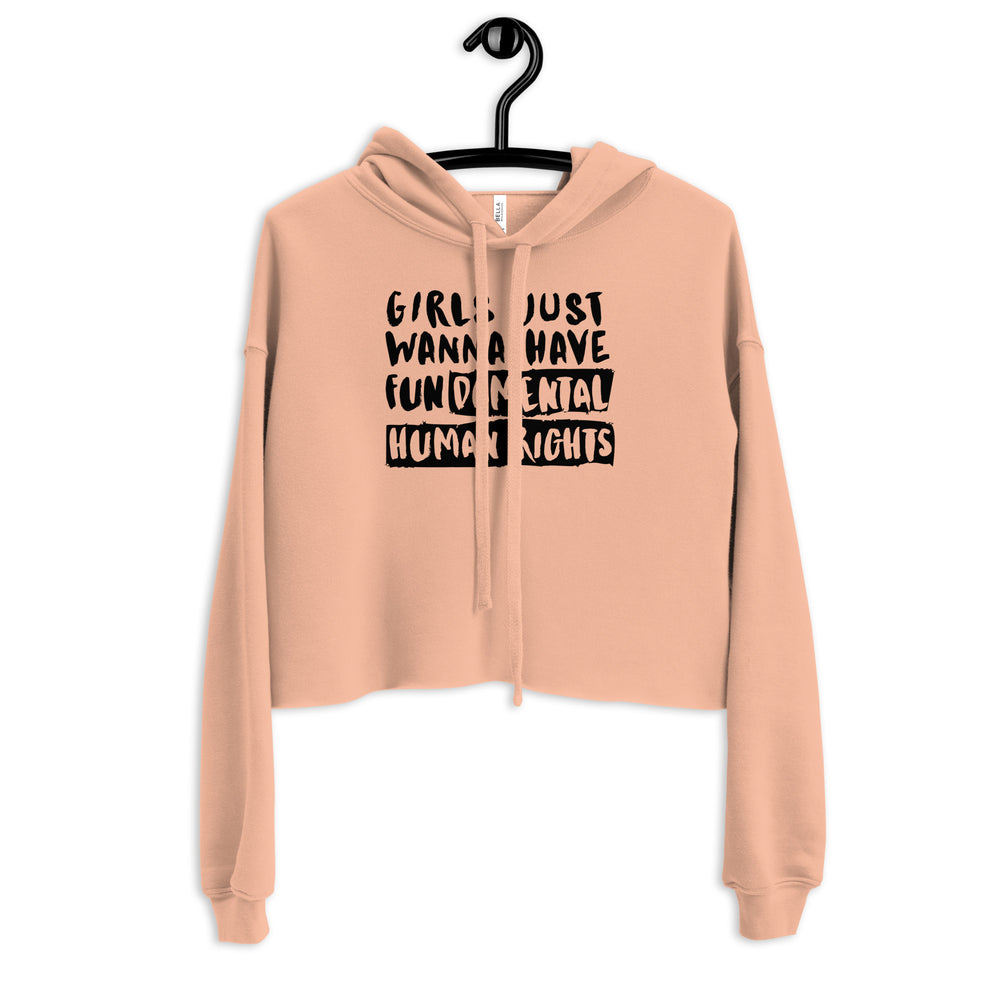 Front view of a peach cropped hoodie reading “Girls Just Wanna Have Fundamental Human Rights”