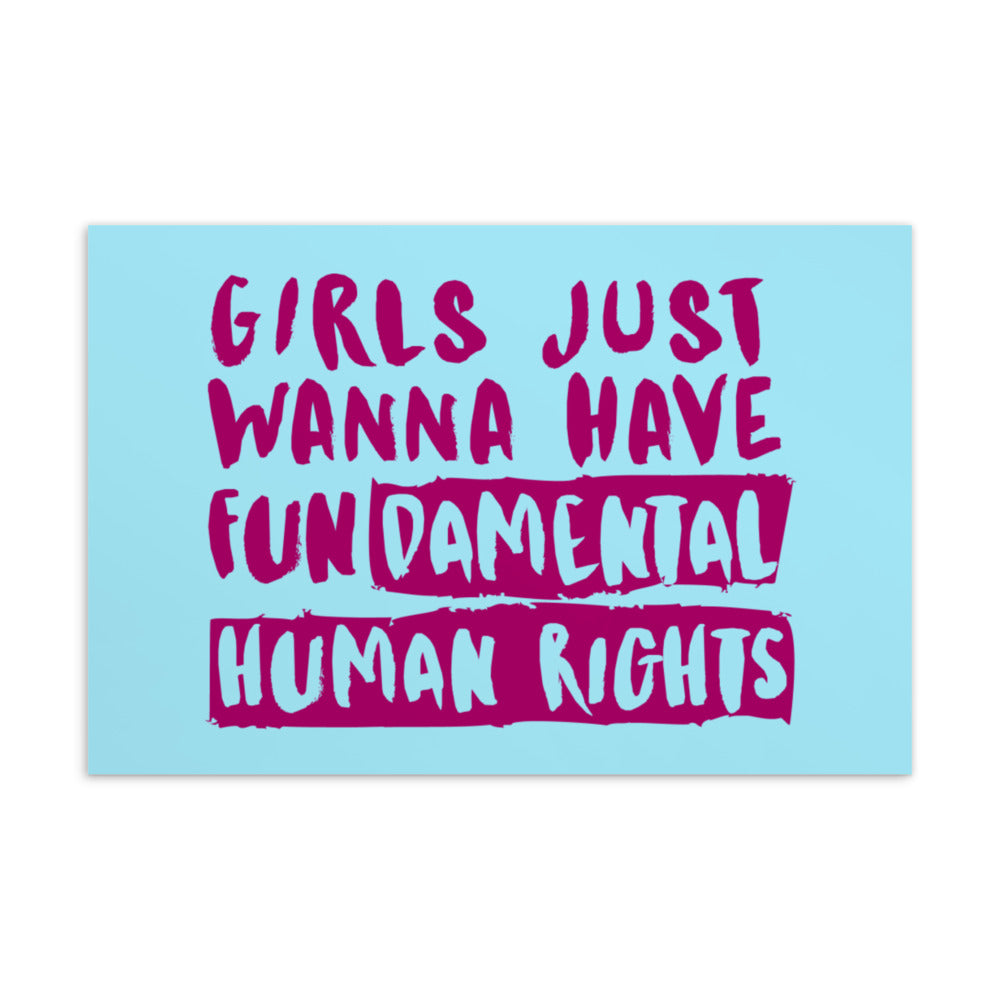 Blue postcard reading “Girls Just Wanna Have Fundamental Human Rights” in magenta lettering