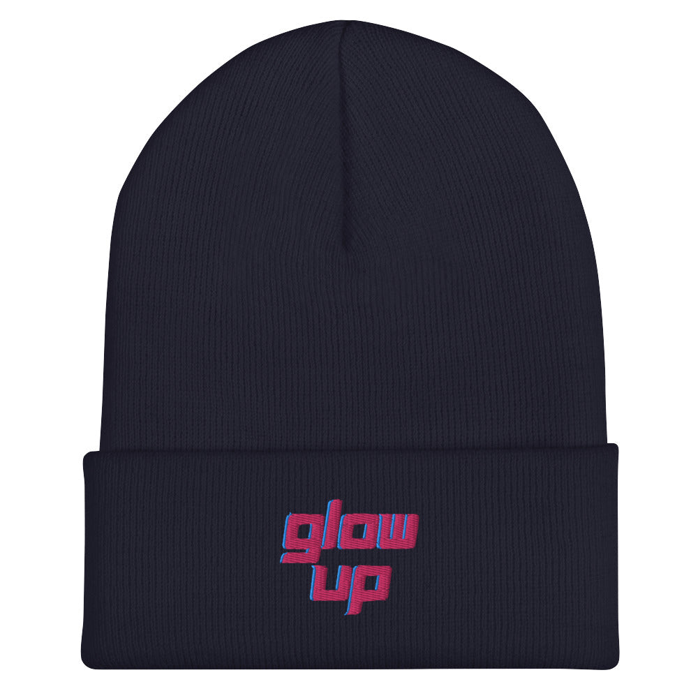 Front-facing dark navy ribbed cuffed beanie embroidered with pink and blue “glow up” text