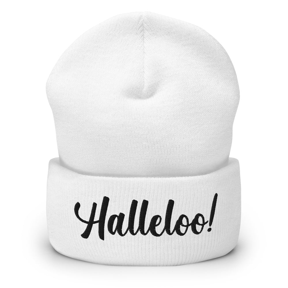 Front view of a white cuffed knit beanie with black script reading “Halleloo!”
