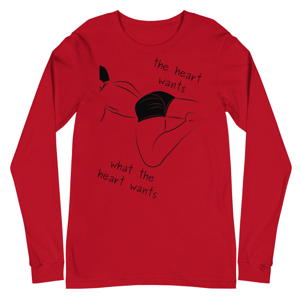 Front view of a red long-sleeve shirt with a black reclining figure and “the heart wants what the heart wants”