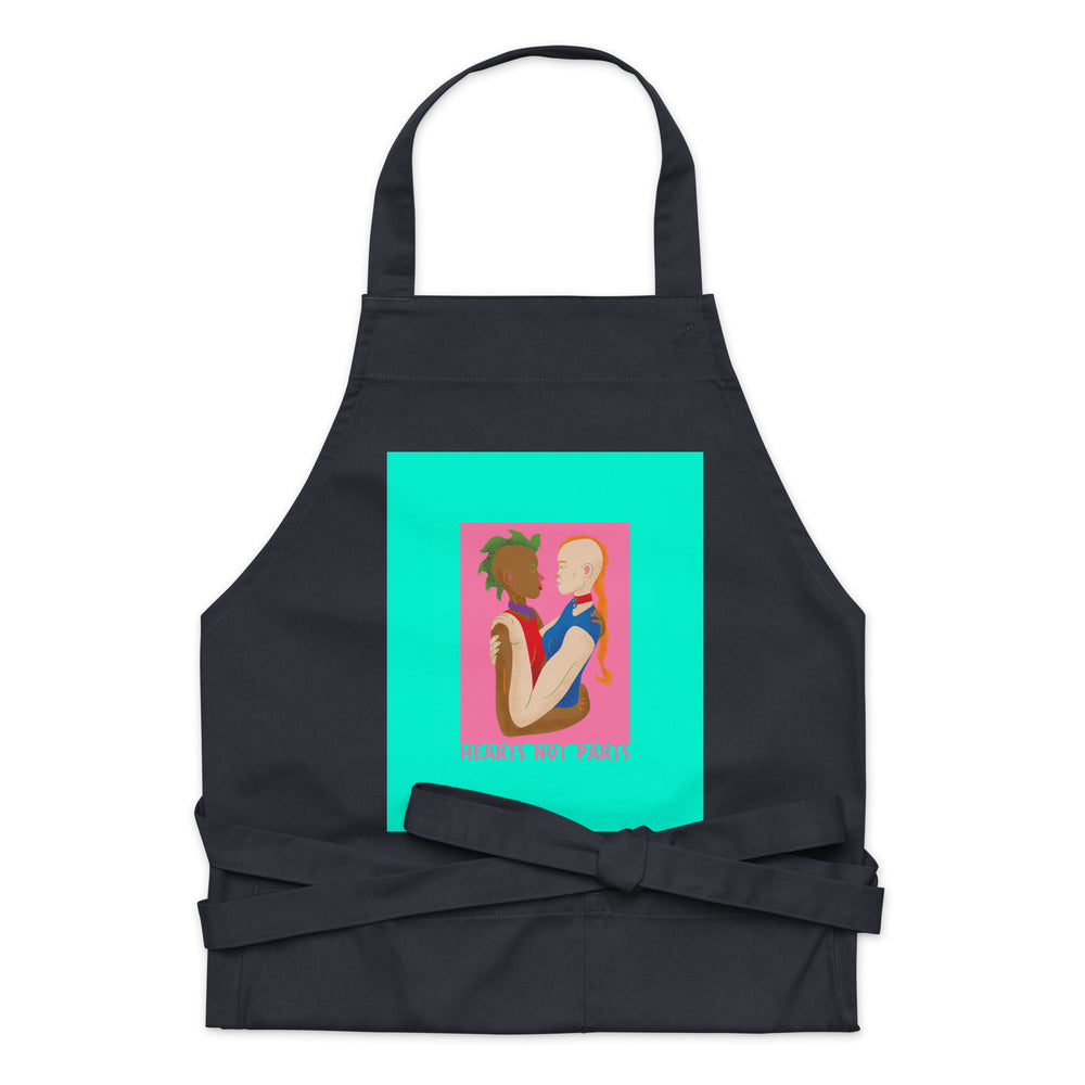 Front-view black apron with a turquoise panel showing two figures and “HEARTS NOT PARTS”
