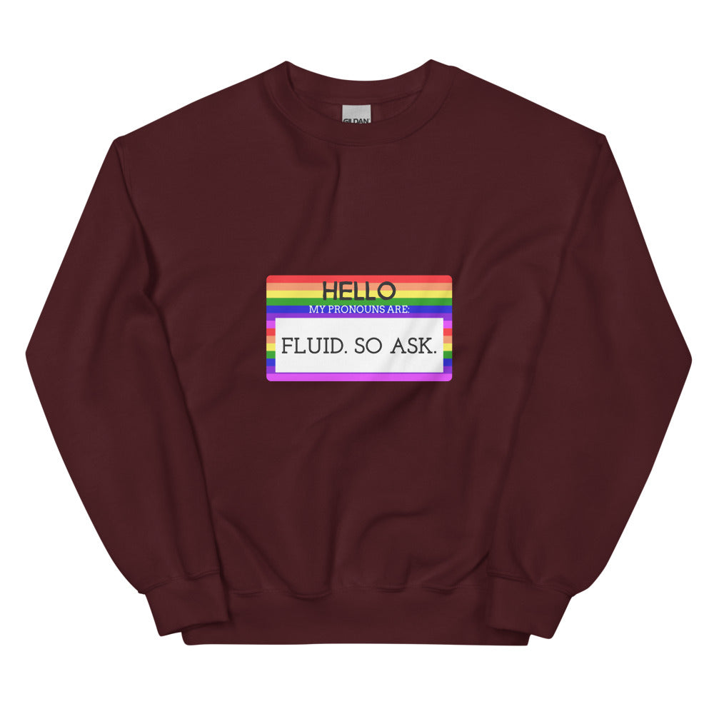 Maroon sweatshirt with a rainbow-bordered chest graphic reading “HELLO MY PRONOUNS ARE: FLUID. SO ASK.”