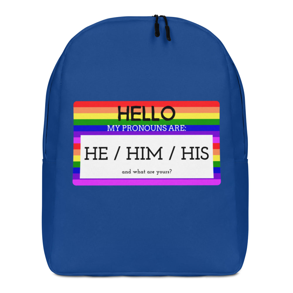 Front view of a blue backpack with a rainbow-striped pronoun panel reading “HE / HIM / HIS.”
