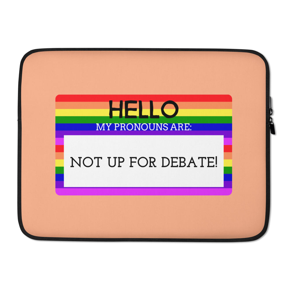 Front view of a peach laptop sleeve with a rainbow-striped pronoun message: “HELLO MY PRONOUNS ARE: NOT UP FOR DEBATE!”