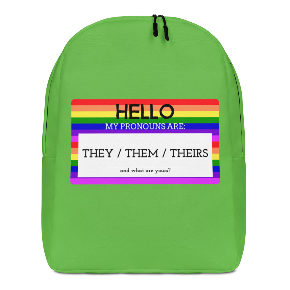Front view of a green backpack with a rainbow pronoun panel reading “HELLO” and “THEY / THEM / THEIRS.”