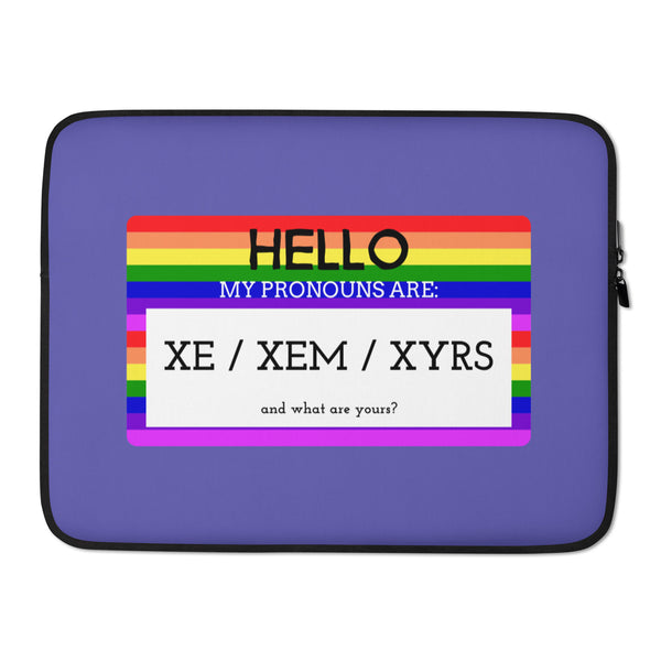 Purple laptop sleeve with rainbow stripes reading “HELLO, MY PRONOUNS ARE: XE / XEM / XYRS”