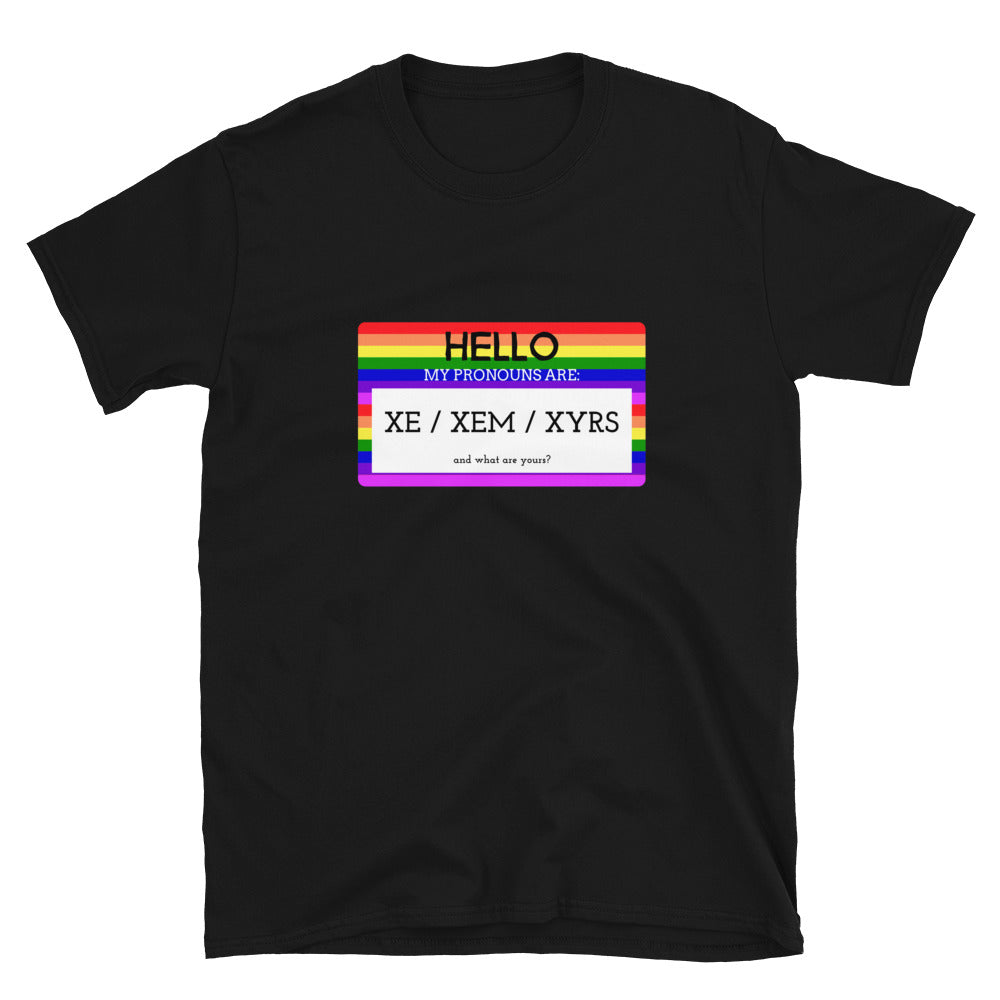 Black T-shirt with a rainbow-bordered pronoun graphic reading “HELLO MY PRONOUNS ARE: XE / XEM / XYRS”