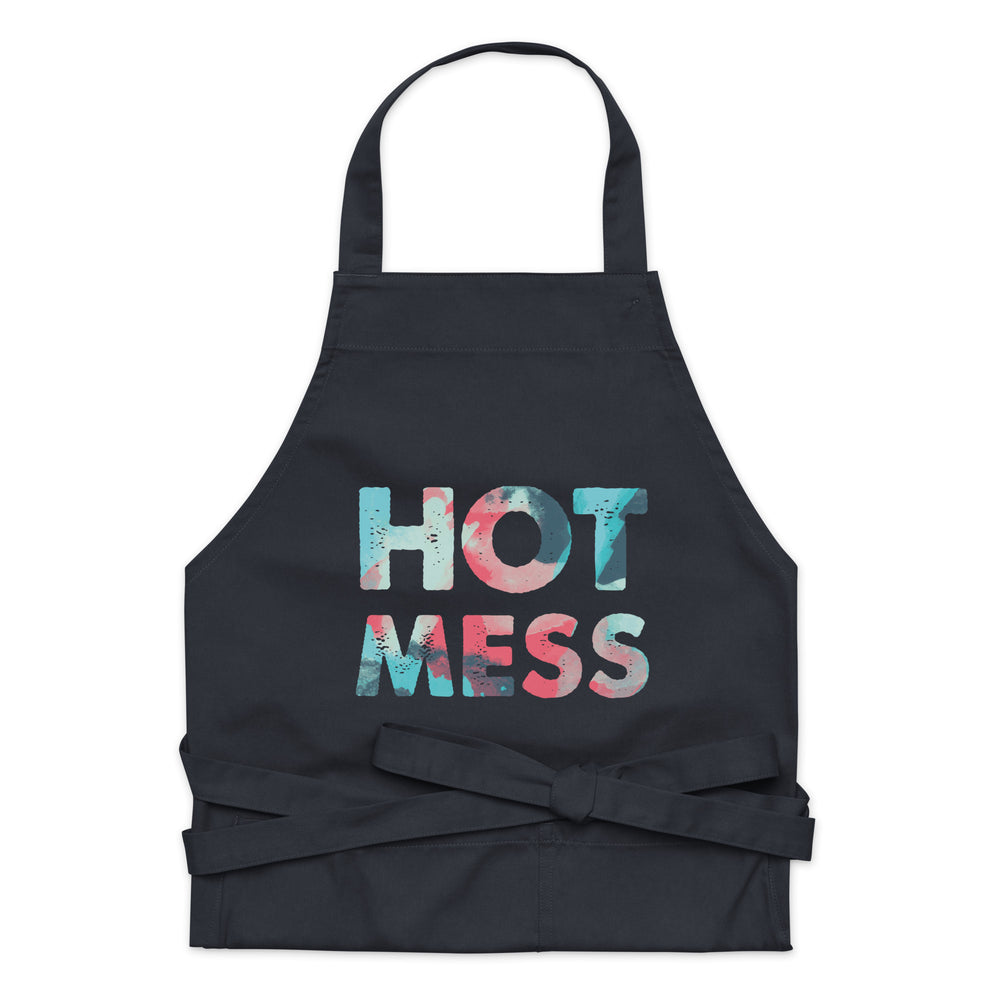 Front-facing black apron with a colorful “HOT MESS” graphic and tied waist straps