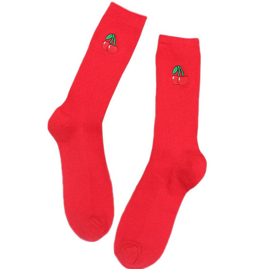 Pair of bright red crew socks with embroidered cherry motifs, shown on a white background