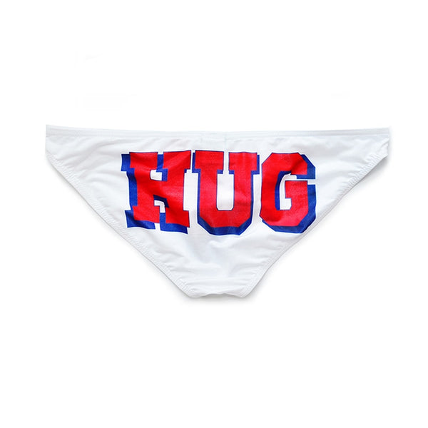 White brief underwear with large red and blue “HUG” lettering, shown flat from the front