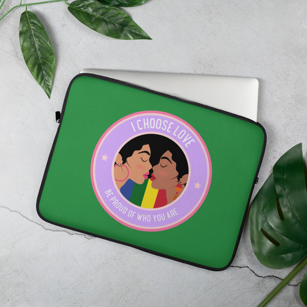 Angled green laptop sleeve with two women kissing and the words “I CHOOSE LOVE” and “BE PROUD OF WHO YOU ARE”