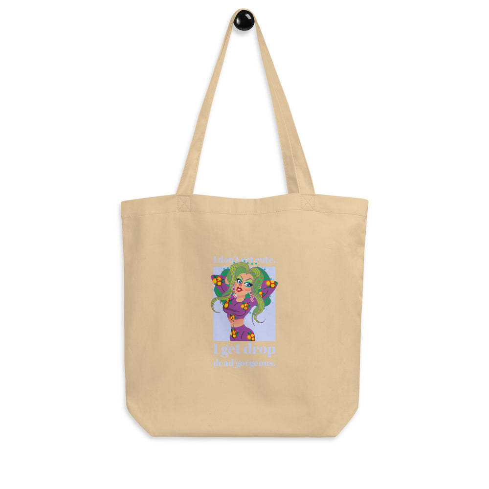 Oyster tote bag with a cartoon woman and the text “I don't get cute. I get drop dead gorgeous.”
