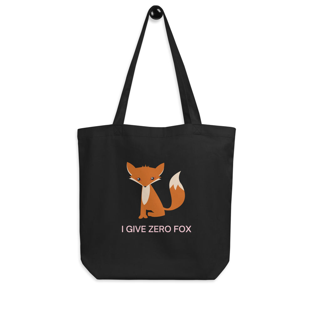 Front-facing black tote bag with an orange fox and pink text, “I GIVE ZERO FOX.”