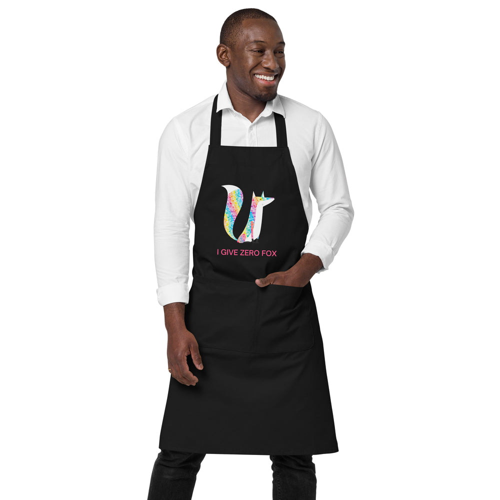 Model wearing a black apron with a colorful fox graphic and “I GIVE ZERO FOX” text