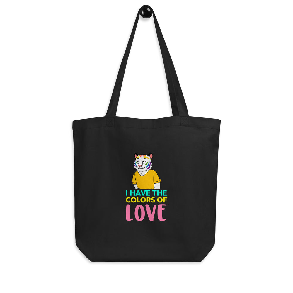 Front view of a black tote bag with a rainbow-faced tiger and “I HAVE THE COLORS OF LOVE” text