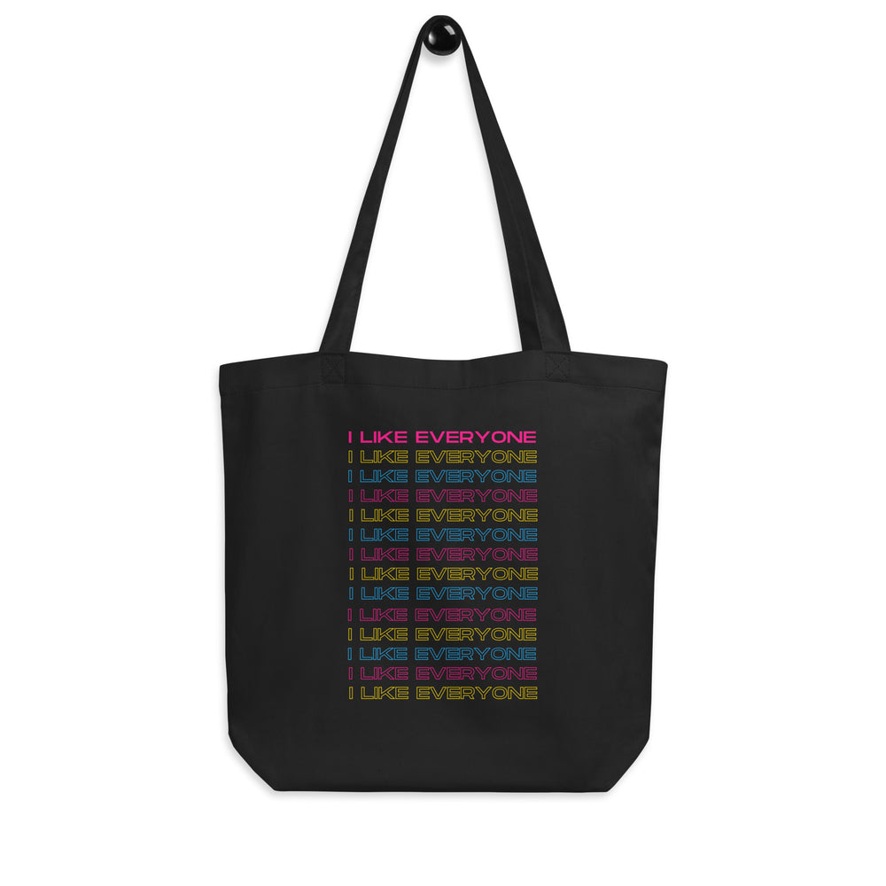 Black tote bag printed with repeated multicolored “I LIKE EVERYONE” text
