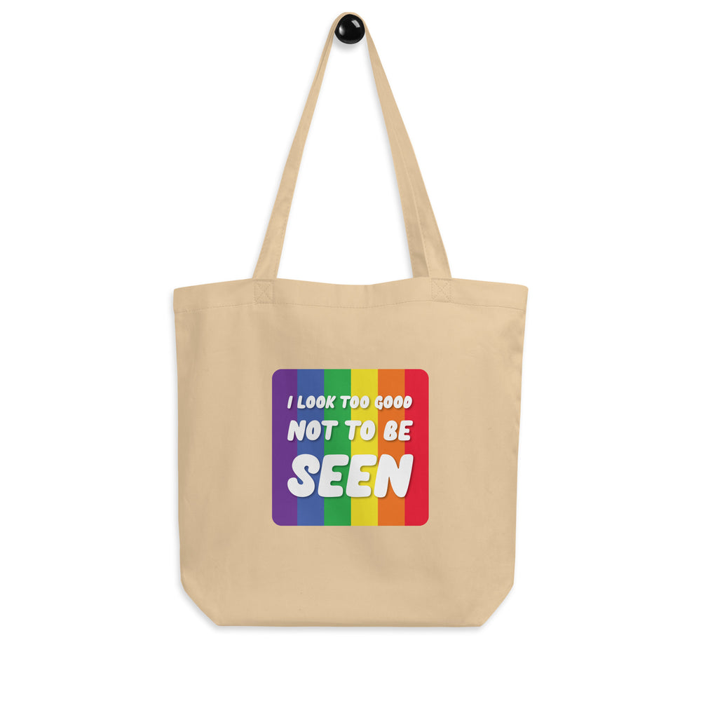 Oyster canvas tote bag with rainbow stripes and the text “I LOOK TOO GOOD NOT TO BE SEEN”