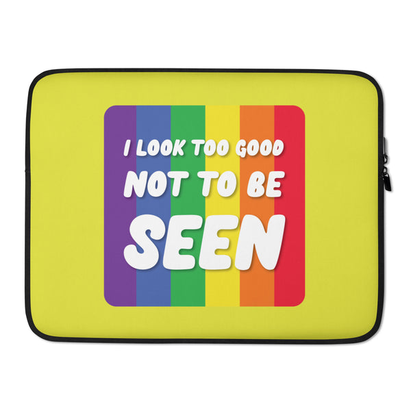 Front view of a yellow laptop sleeve with rainbow stripes and “I LOOK TOO GOOD NOT TO BE SEEN”