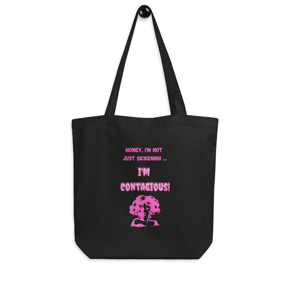Black tote bag with pink text reading “Honey, I’m not just sickening … I’m contagious!”