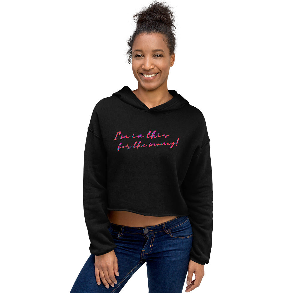 Front view of a smiling model wearing a black cropped hoodie reading “I'm in this for the money!”