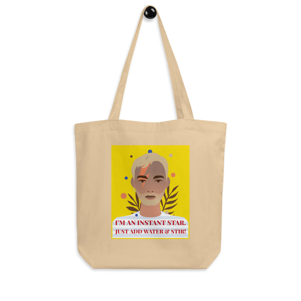 Oyster canvas tote bag with a stylized portrait and “I'M AN INSTANT STAR. JUST ADD WATER & STIR!”
