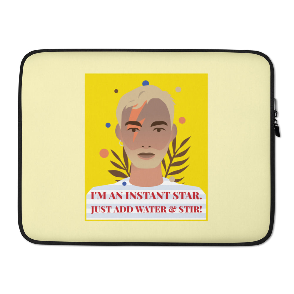 Front view of a pale yellow laptop sleeve with a stylized portrait and “I'M AN INSTANT STAR. JUST ADD WATER & STIR!”