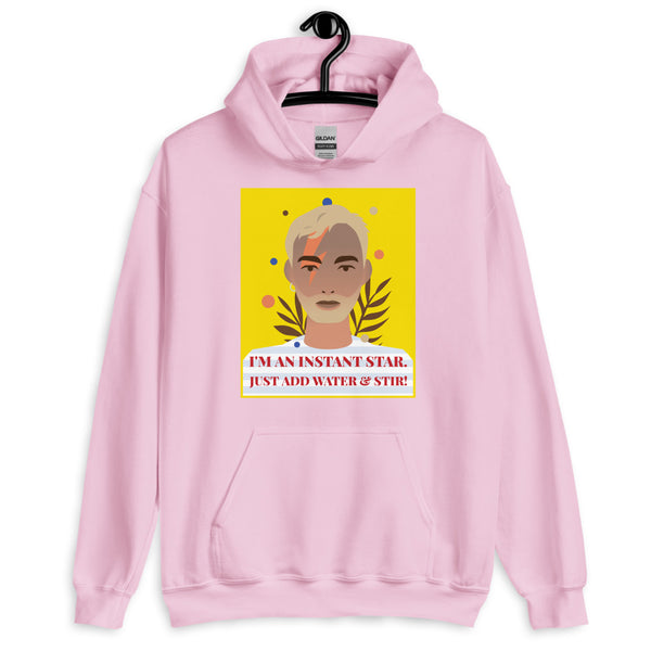 Front-view pink hoodie with a portrait graphic and “I'M AN INSTANT STAR. JUST ADD WATER & STIR!”