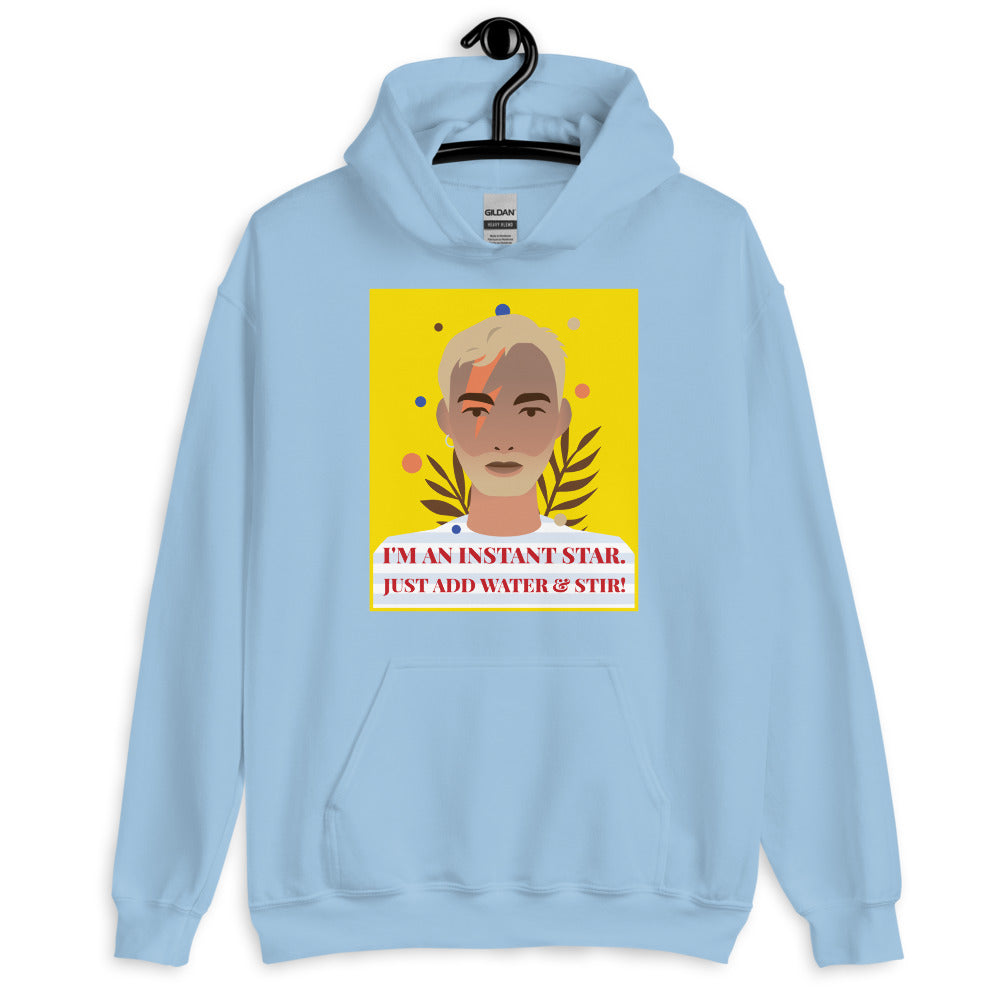 Light blue hoodie on a hanger with a colorful portrait and “I’M AN INSTANT STAR” graphic