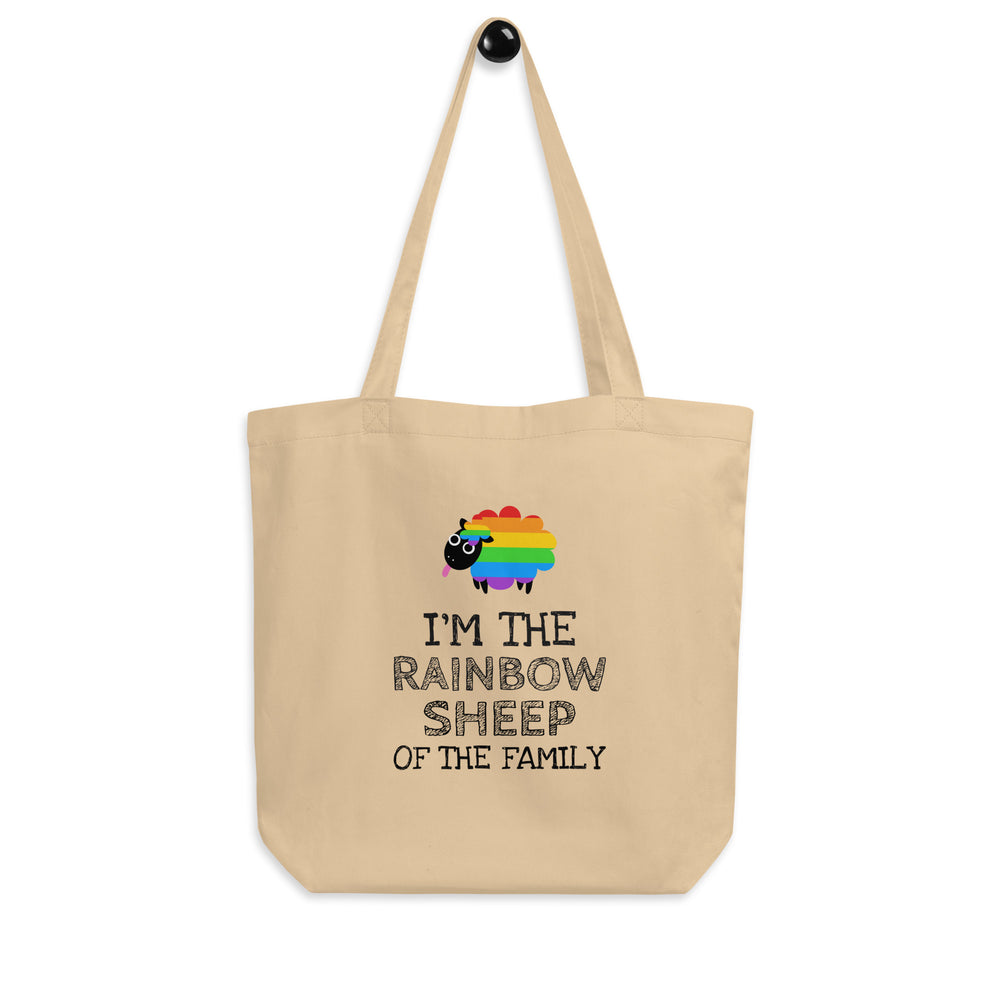 Front view of a beige tote bag with a rainbow sheep and “I’M THE RAINBOW SHEEP OF THE FAMILY”