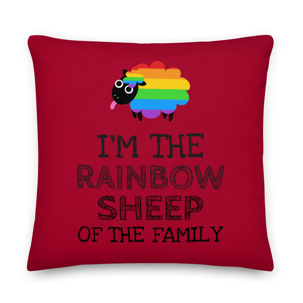 Red square pillow with a rainbow sheep and the words “I’M THE RAINBOW SHEEP OF THE FAMILY”