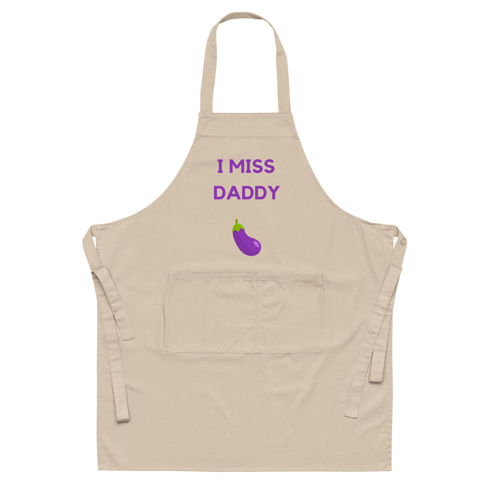 Front-facing beige apron with purple “I MISS DADDY” text and eggplant graphic