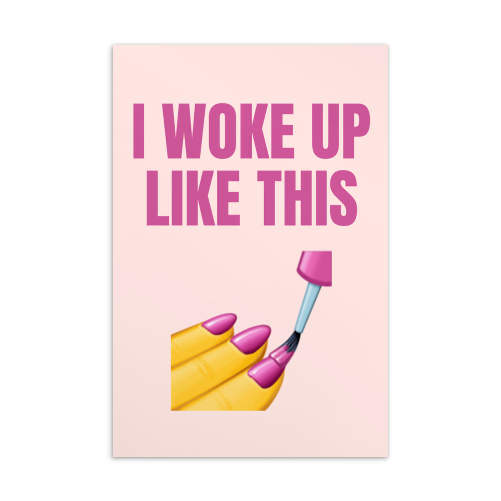 Pink postcard reading “I WOKE UP LIKE THIS,” with a painted yellow fingernail and brush