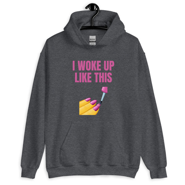Front view of a dark gray hoodie reading “I WOKE UP LIKE THIS” with a manicure graphic