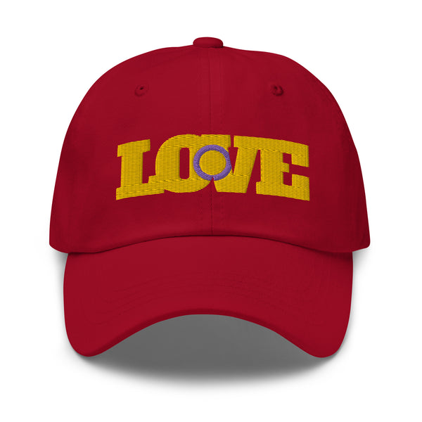 Front view of a red baseball cap embroidered with yellow “LOVE” and a purple symbol
