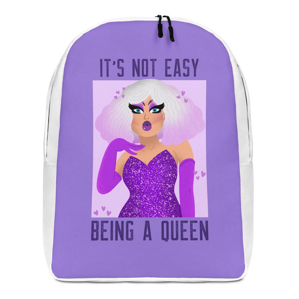 Front-facing purple backpack with white trim reading “IT’S NOT EASY BEING A QUEEN”