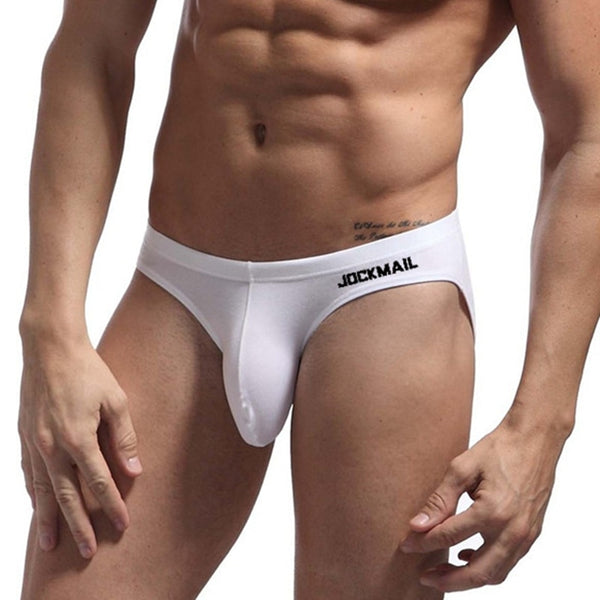 Front view of a model wearing white Jockmail briefs with a contoured pouch