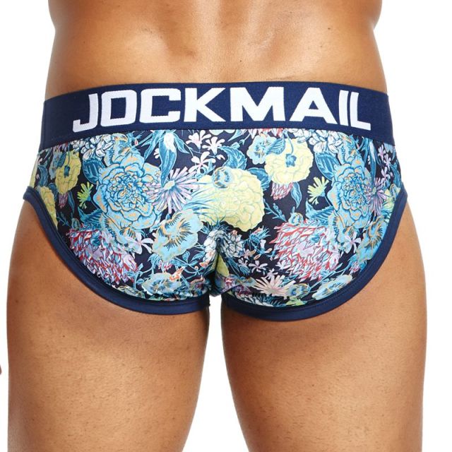 Model wearing navy floral-print briefs with a contrasting JOCKMAIL waistband