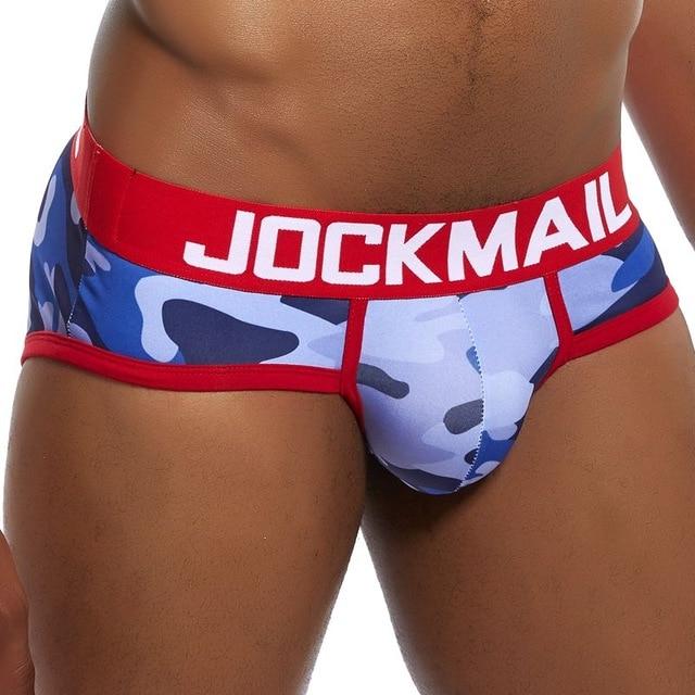 Front close-up of blue camouflage brief underwear with red trim and JOCKMAIL waistband