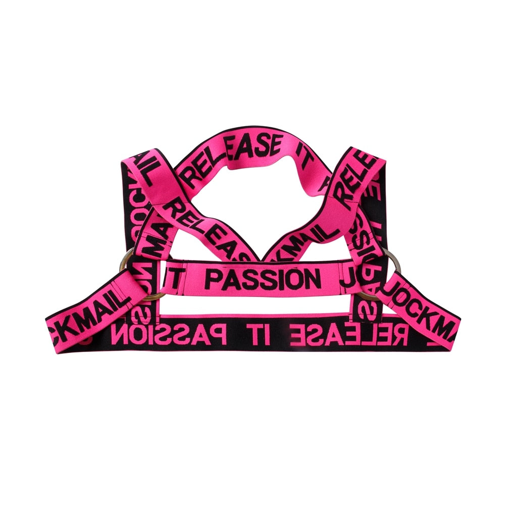 Flat lay of a neon pink elastic harness with black “RELEASE IT” and “PASSION” text