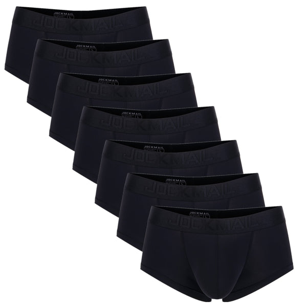 Seven black Jockmail boxer briefs arranged diagonally on a white background