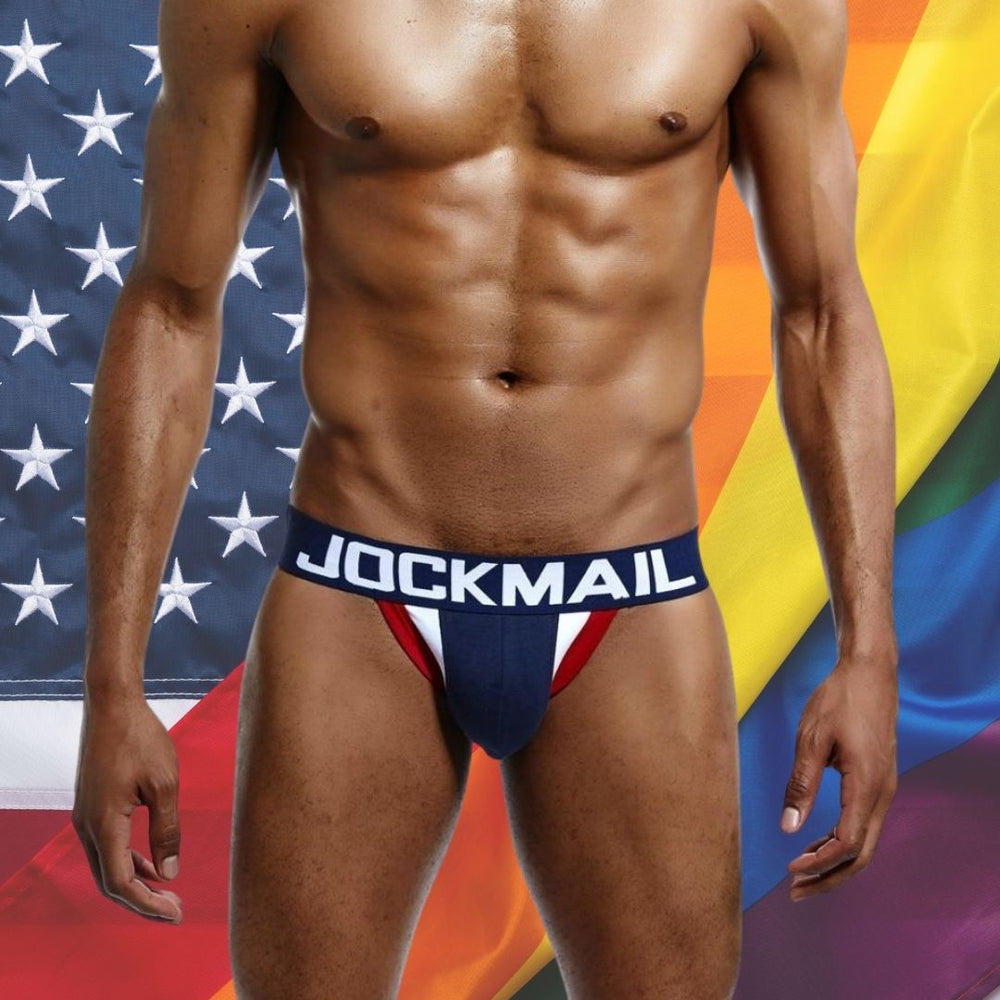 Model wearing a red, white and blue American flag jockstrap with JOCKMAIL waistband
