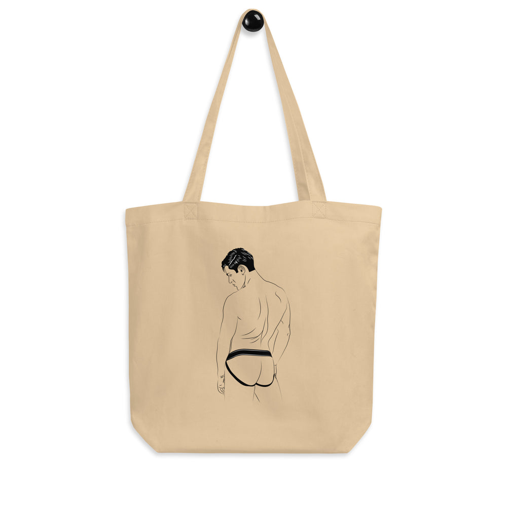 Natural canvas tote bag featuring a rear-view illustration of a man in a black jockstrap