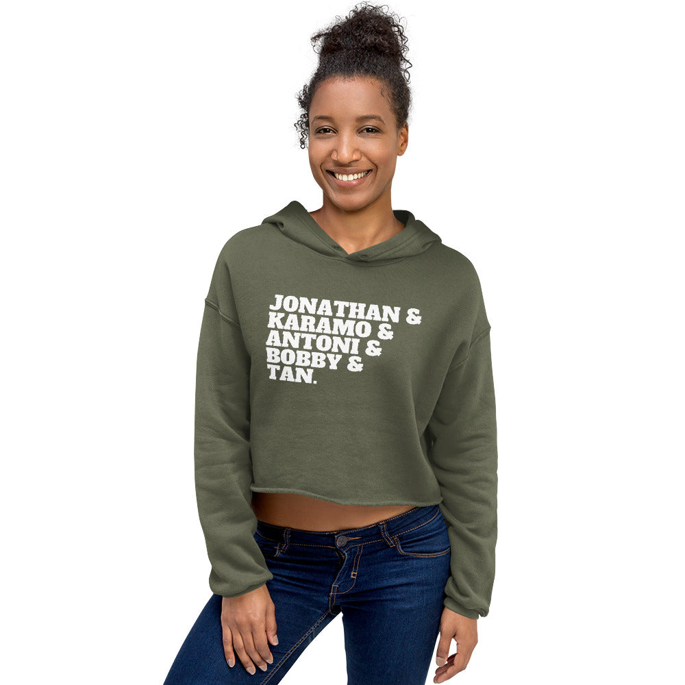 Model wearing an olive cropped hoodie reading “JONATHAN & KARAMO & ANTONI & BOBBY & TAN.”