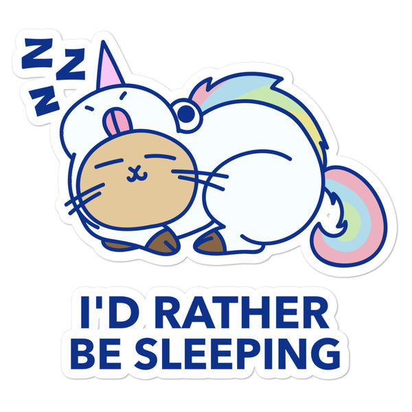 Sticker with sleeping pastel cat illustration, rainbow tail, and “I'D RATHER BE SLEEPING” text