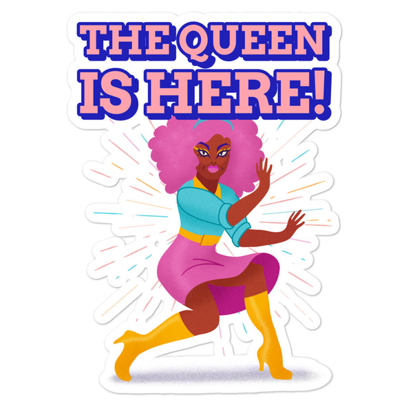 Sticker reading “THE QUEEN IS HERE!” above a colorful drag queen illustration
