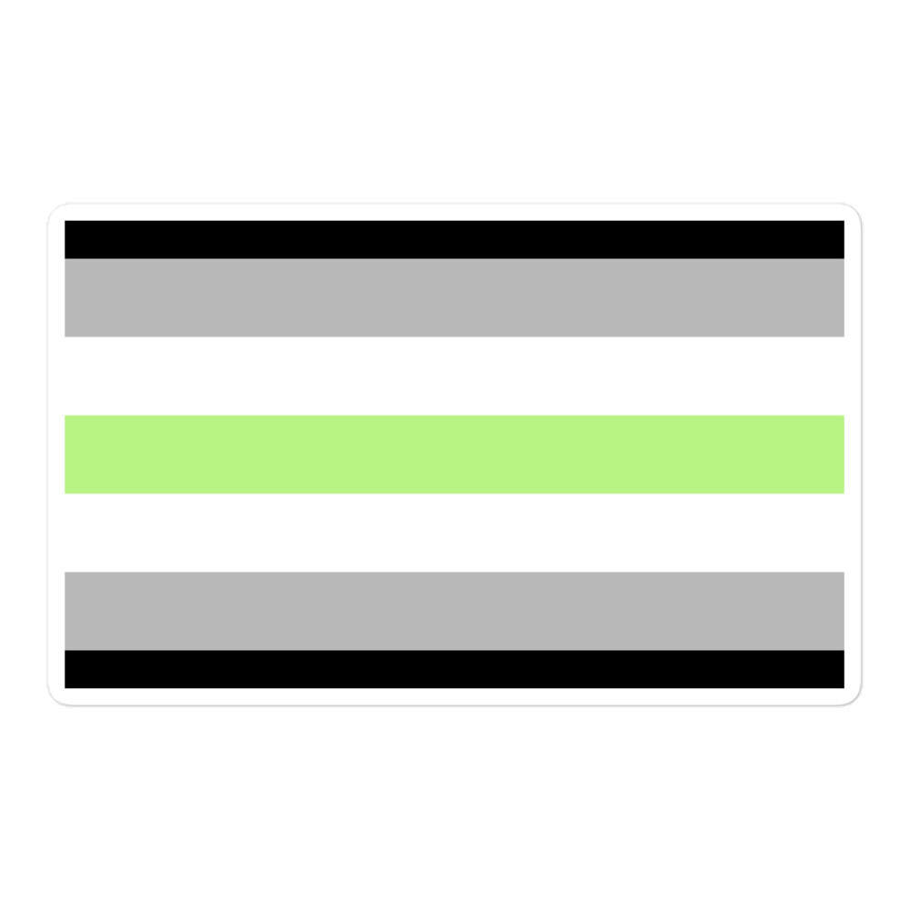 Black reusable coffee cup repping Agender Flag stickers—horizontal black, gray, white, and green stripes—on a wood table with spilled coffee beans.