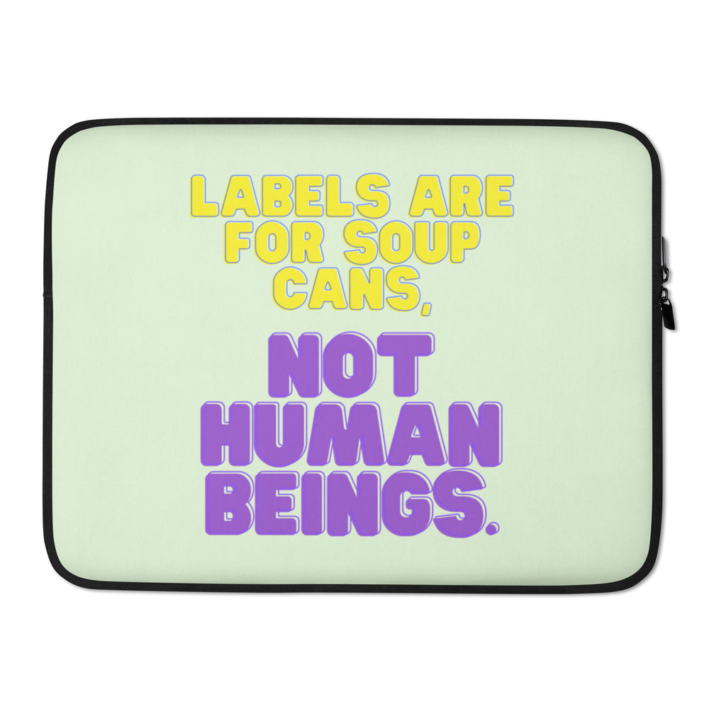 Front-facing pale green laptop sleeve reading “Labels Are For Soup Cans, Not Human Beings.”