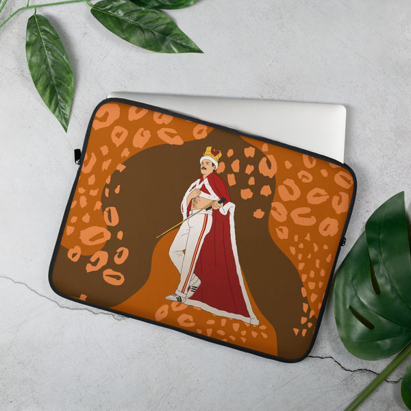 Laptop sleeve showing an illustrated crowned performer in a red cape on an orange leopard-print background