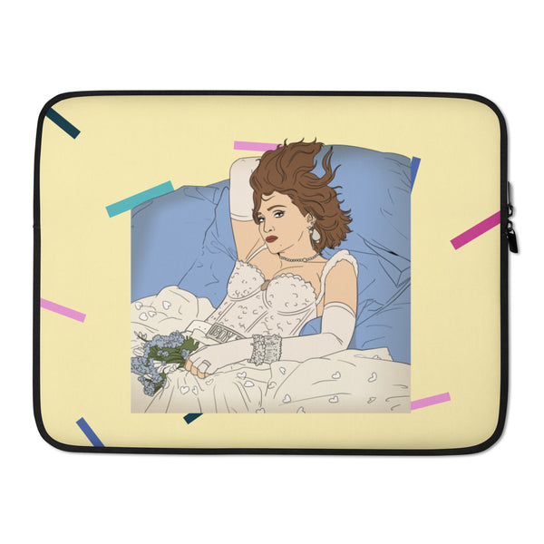 Laptop sleeve showing a reclining woman in a white corset on blue pillows, surrounded by confetti